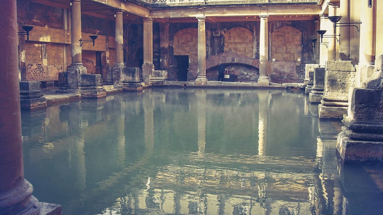 The columned Roman bath with green mineral water.